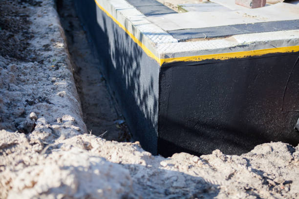 Professional Basement Waterproofing technician working in Winchester, KY